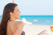 © nenadaksic - Young woman chilling on the beach