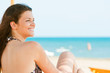 © nenadaksic - Young woman chilling on the beach