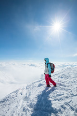 Sticker - Hiker posing at top of snowy mountain during sunny day