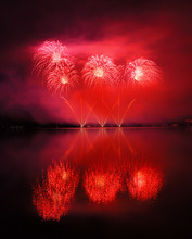 Beautiful Red Fireworks Reflecting In Water