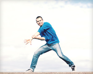 Wall Mural - handsome boy making dance move