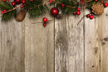 Wall Mural - Aged wood Christmas background with branch and bauble top border