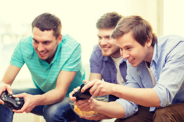 Poster - smiling friends playing video games at home