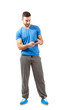 Fit sporty male using smart phone
