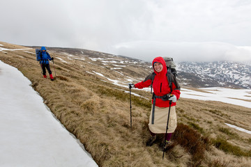 Sticker - Hiker in winter mountains on cloudy day