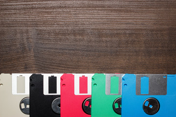 retro technology concept diskette on wooden background