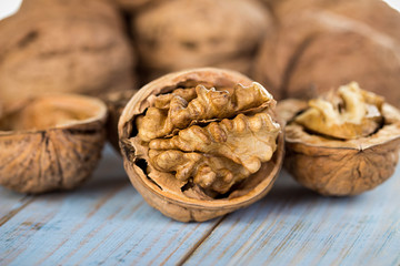 Wall Mural - Half walnut kernel and whole walnuts