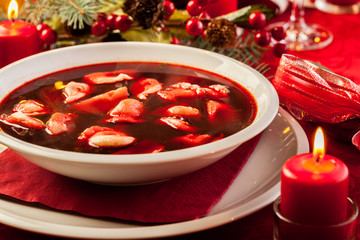 Wall Mural - Christmas red borscht with meat filled dumplings