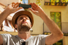 Tourist Man Takes Photo On Mobile Phone - Summer Holiday
