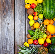 Huge Group Of Fresh Colorful Fruit On Wooden Background - Health