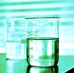 Wall Mural - laboratory research, beaker containing chemical liquid