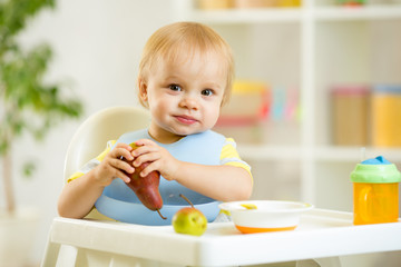 Wall Mural - baby kid child boy eating fruits