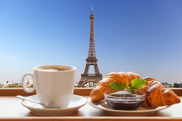 Wall Mural - Coffee with croissants against Eiffel Tower in Paris, France