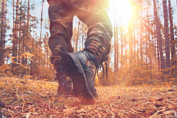 feet in shoes autumn forest hike