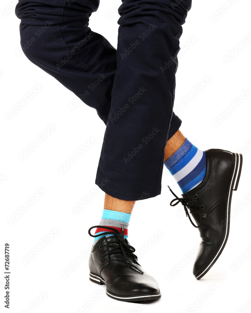 Man leg in suit and colorful socks, isolated on white