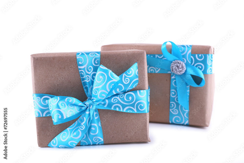 Holiday gift boxes decorated with blue ribbon isolated on white