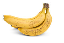 Bunch Of Ripe Bananas With Dark Spots On A White Background