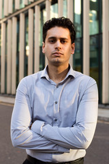 young business man with crossed arms.