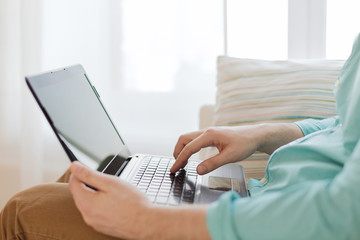 Poster - close up of man working with laptop at home