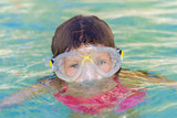 Fototapeta  - young child girl snorkelling in mask