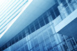 © grapestock - Light blue background of glass high rise building