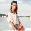 © Kaponia Aliaksei - Portrait of a beautiful woman with watermelon at the sea