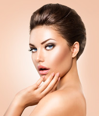 Wall Mural - beautiful young woman with clean fresh skin closeup