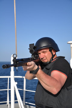 Fototapete - armed guard on board sea going vessel in aden gulf