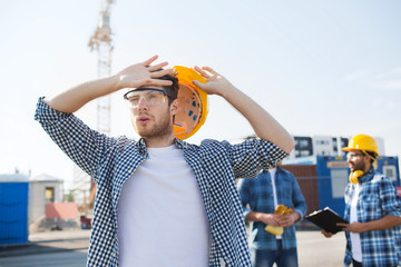 Poster - group of builders in hardhats outdoors