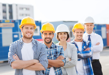 Sticker - group of smiling builders in hardhats outdoors