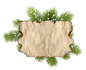 Old parchment paper with copy space on Christmas tree branch bac