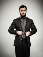 Wall Mural - Handsome man with beard wearing jacket