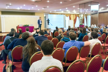 people sitting rear at the business conference