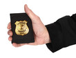 Man hand is holding golden special officer badge