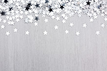 Star Confetti On Silver Metal Background
