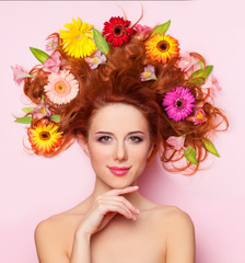 Poster - Beautiful redhead girl with flowers on pink background