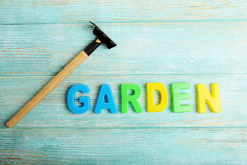 Wall Mural - Garden word formed with colorful letters on wooden background