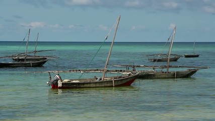 Sticker - Zanzibar dhows anchored in the clear coastal waters