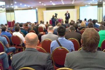 people sitting rear at the business conference