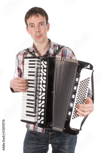 Fényképezés Man playing an accordion isolated over white