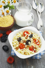 Wall Mural - Millet porridge with dried apricots and prunes