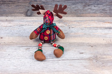 Christmas Reindeer Toy On Wooden Background