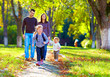 © Olesia Bilkei - happy family on walk in park