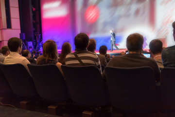 people sitting rear at the business conference