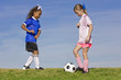 © Brocreative - Two young girls playing soccer (simple background)