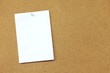 Blank memo paper pinned on cork noticeboard