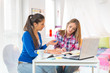 © Stock Rocket - Two female students looking at laptop
