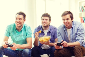 Poster - smiling friends playing video games at home