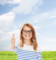 Wall Mural - little girl with black eyeglasses