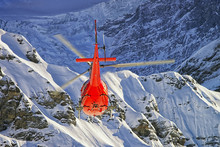 Red Helicopter At Swiss Alps Near Jungfrau Mountain